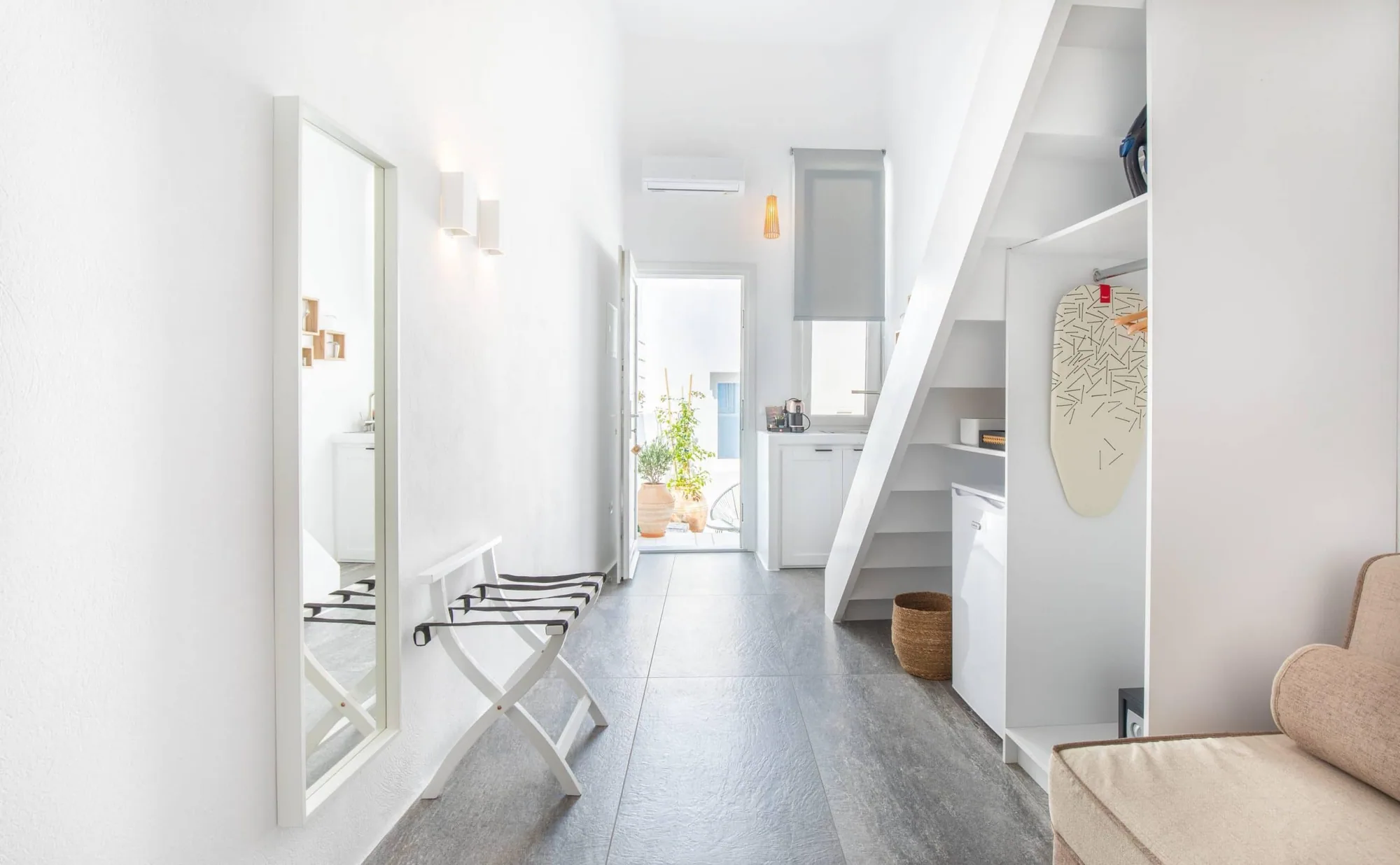 Hallway with luggage rack and mirror